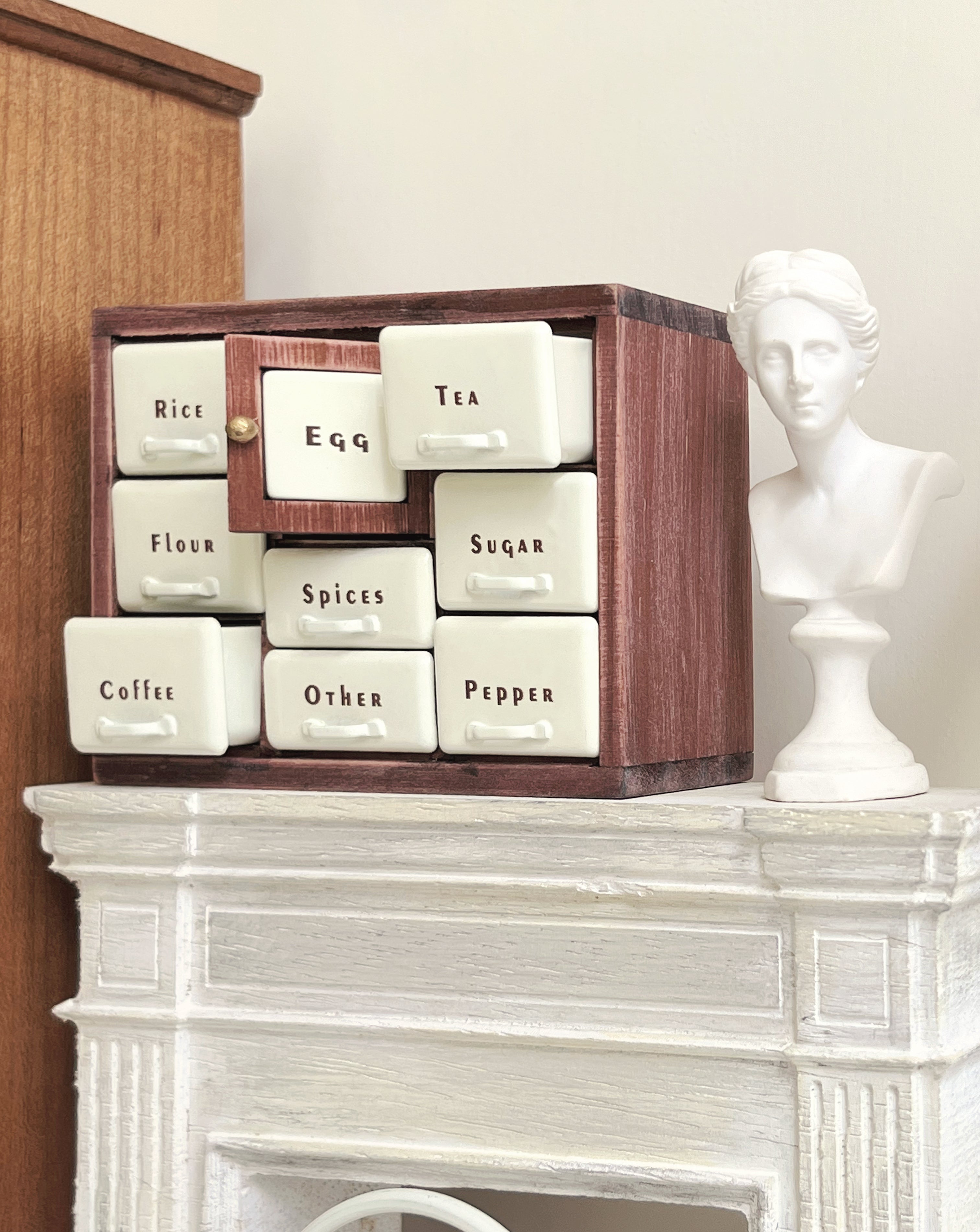 Red Bean spice cabinet close-up with open Coffee drawer and center Egg door

