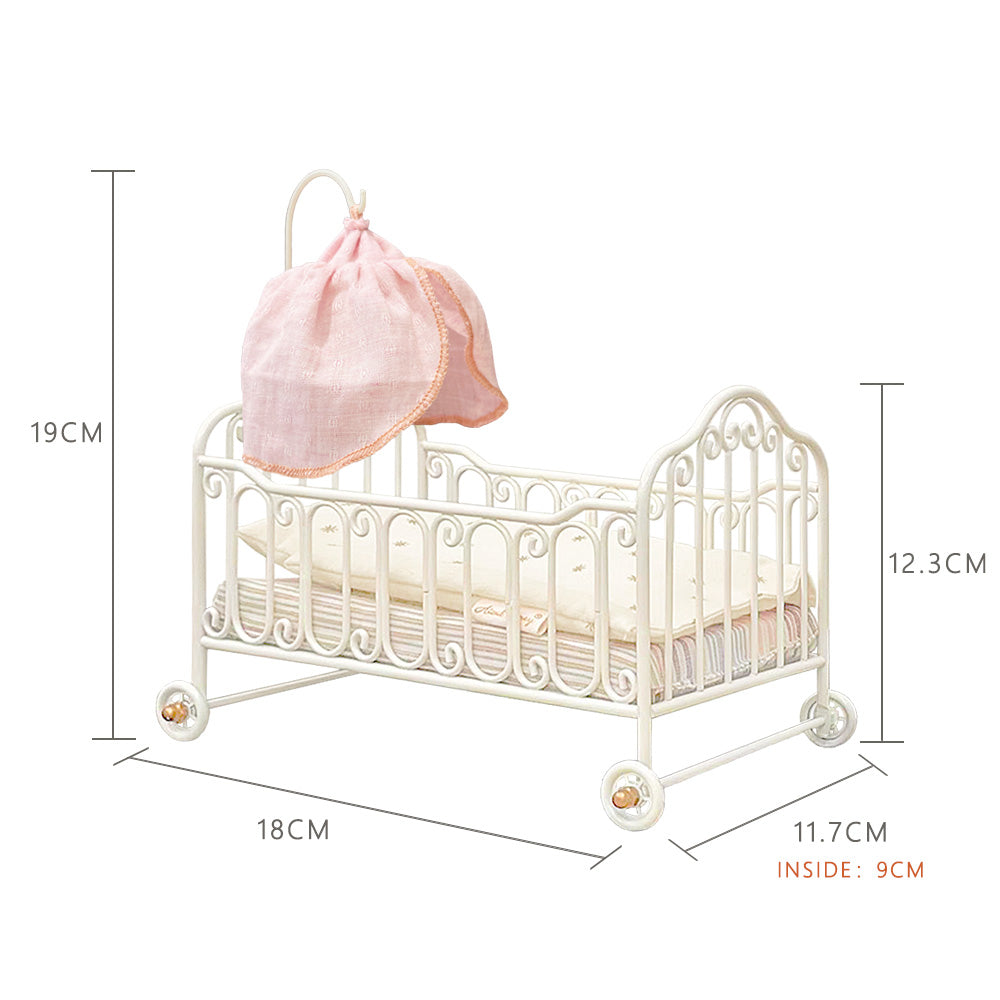 Dimension guide for a cream-white metal baby cot showing L 18 x W 11.7 x H 12.3 cm, 19 cm overall height with canopy support and 9 cm interior width